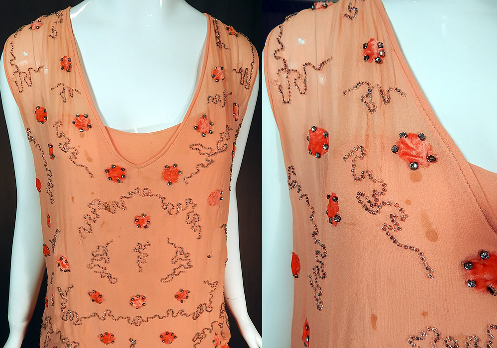 Vintage Art Deco Orange Silk Velvet Applique Rhinestone Beaded Flapper Dress
It is in good as-is condition with a small hole on the front shoulder, 3 small holes on the bottom skirt and some small faint stains on the front top (see close-ups). This is truly a rare color and exceptional piece of Art Deco wearable beaded textile art!