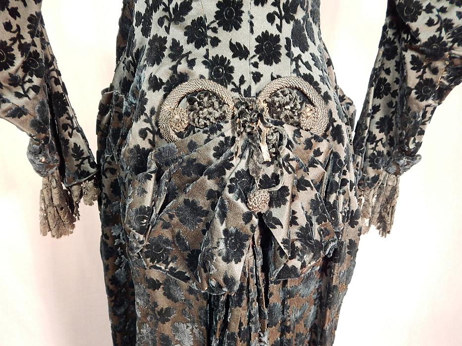 Victorian Black Burnout Voided Velvet Cutaway Polonaise Dress Bustle Bodice
The polonaise measures 22 inches long in the front, 49 inches long in the back, with a 34 inch bust, 24 inch waist, 12 1/2 inch back shoulder seam and 19 inch long sleeves. It is in good condition, with only some slight wear to the velvet nap edging around the collar. This is truly an amazing piece of antique Victoriana wearable textile art! 