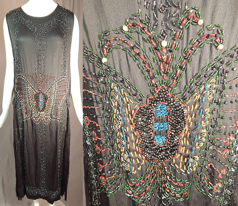 Vintage Art Deco Black Silk Colorful Beaded Butterfly Fringed Flapper Dress
This amazing Art Deco vintage black silk colorful beaded butterfly fringed flapper dress dates from the 1920s. It is made of a black silk crepe de chine fabric, with black beadwork and colorful beading creating a large beautiful beaded butterfly on both the front and back.