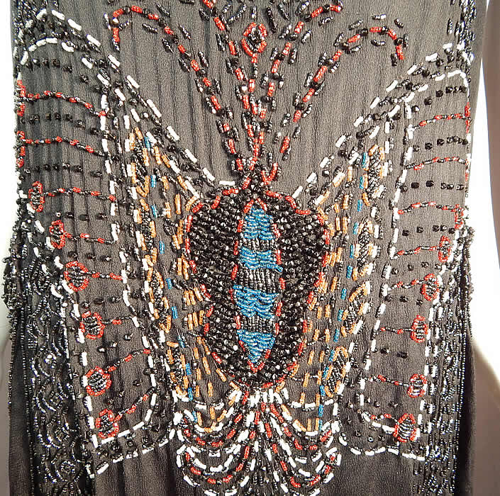 Vintage Art Deco Black Silk Colorful Beaded Butterfly Fringed Flapper Dress
The dress measures 48 inches long, with a 40 inch bust, 40 inch waist and 40 inch hips. 