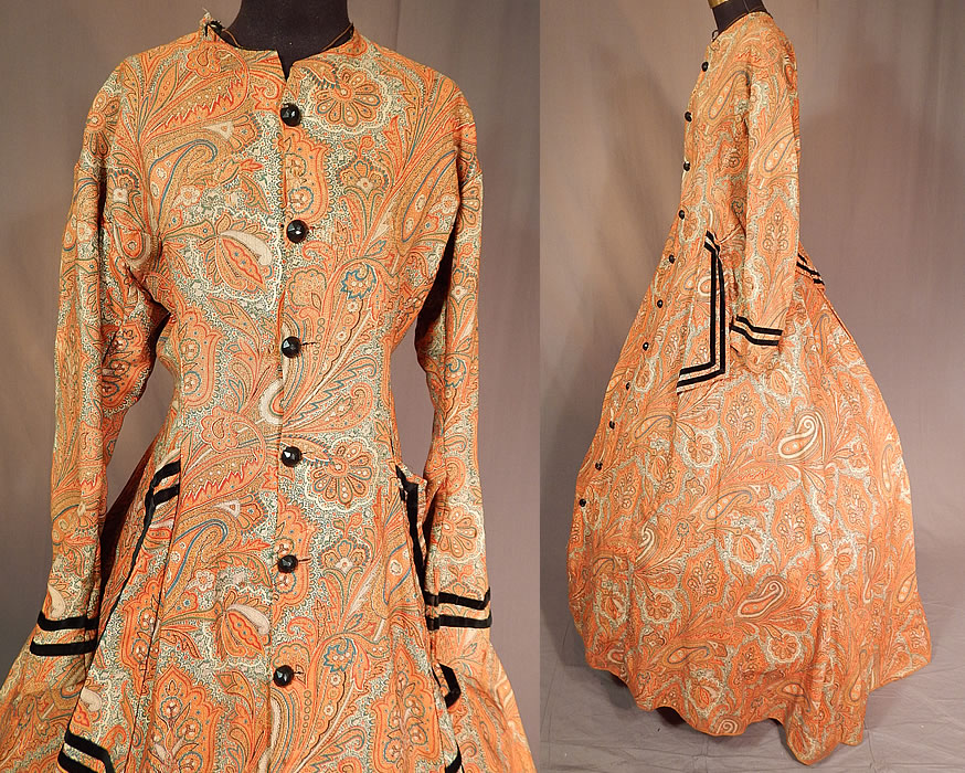 Victorian Civil War Era Paisley Wool Hoop Skirt Morning Wrapper Gown Dress
This wonderful wrapper morning gown dress has a long floor length full hoop skirt (hoop not included underneath), with black velvet piping trim accents on the sleeve cuffs, front faux pocket sides, back skirt drape, with newly replaced faceted plastic black button closures all the way down the front and is lined in a brown cotton fabric inside the top, skirt hemline. 