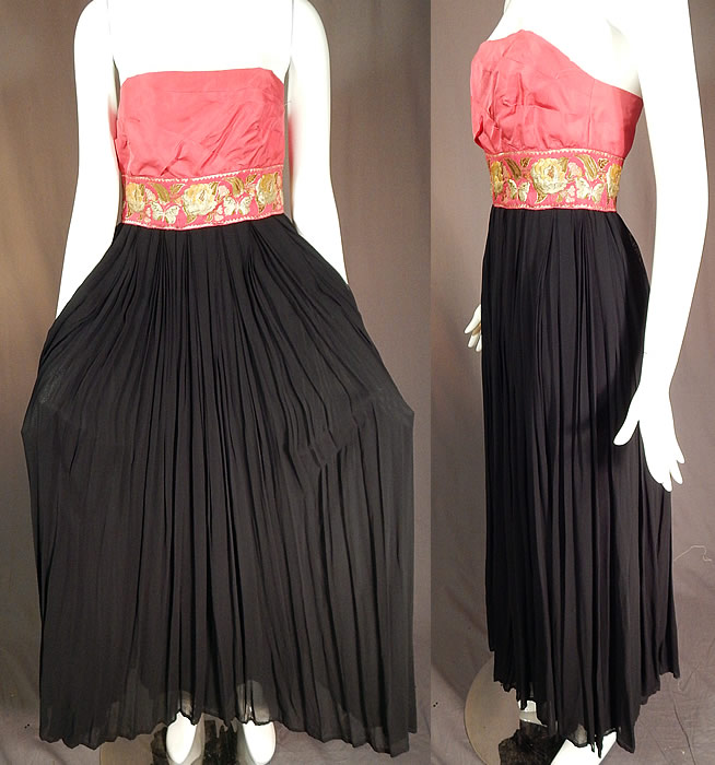 Vintage Pink & Black Pleated Chiffon Strapless Evening Gown Cocktail Dress
This stunning strapless evening gown cocktail dress is a long floor length, with a fitted overlapping strapless bodice top, a floral butterfly gold lam&eacute; pink silk brocade ribbon sash waist, long flowing skirt with black satin lining underneath, back zipper closure and is fully lined with stays boning sewn inside the bodice.