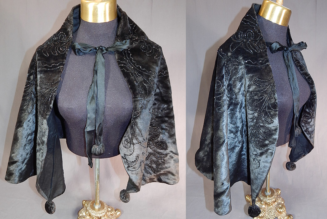 Victorian Black Plush Velvet Jet Beaded Ball Trim Winter Cloak Cape Capelet
This antique Victorian era black plush velvet jet beaded ball trim winter cloak cape capelet dates from 1900. It is made of a black plush velvet fabric, with jet beaded trim done in decorative designs.