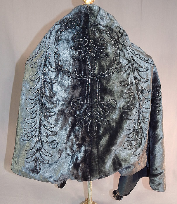 Victorian Black Plush Velvet Jet Beaded Ball Trim Winter Cloak Cape Capelet
This beautiful black beaded short cropped cloak cape capelet has a loose fitting shawl style, with black silk ribbon tie closure at the neck, velvet covered balls with beading trimming the bottom front ends and is fully lined. 