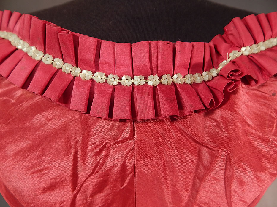 Victorian Civil War Era Red Silk White Beaded Ball Gown Bodice Corset Top
It is made of a crimson red color silk moire taffeta fabric, with a silk box pleat ruffle trim and white beaded neckline. 