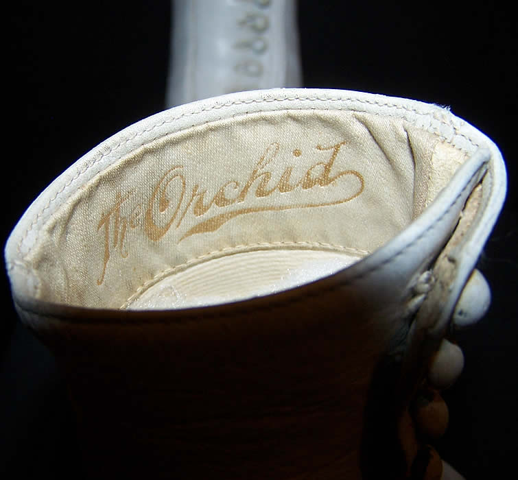 The Orchid Victorian White Leather High Top Button Boots Close up.