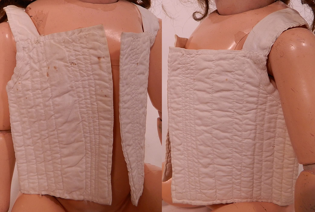 Victorian Antique Doll Infant Child Corset Stays Cotton Quilted Undergarment. Doll not included. This antique Victorian era doll infant child's corset stays cotton quilted undergarment dates from the late 19th century. It is made of a white cotton quilted stitched fabric.
