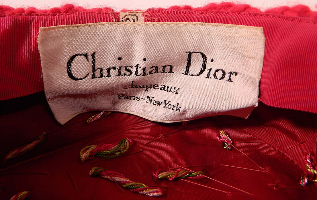 Vintage Christian Dior Chapeaux Pink Knit Ribbon Feather Beaded Trim Turban Hat label close up.