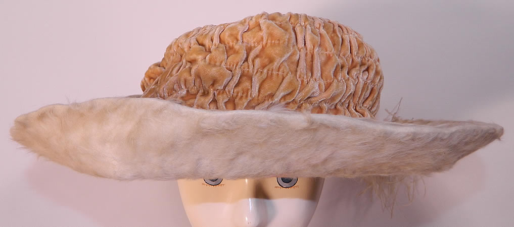 Edwardian Titanic Cream Velvet White Beaver Felt Fur Feather Wide Brim Hat. It is made of a ecru cream color ruched pleated gathered silk velvet fabric crown and an off white plush beaver felt fur fabric brim. 