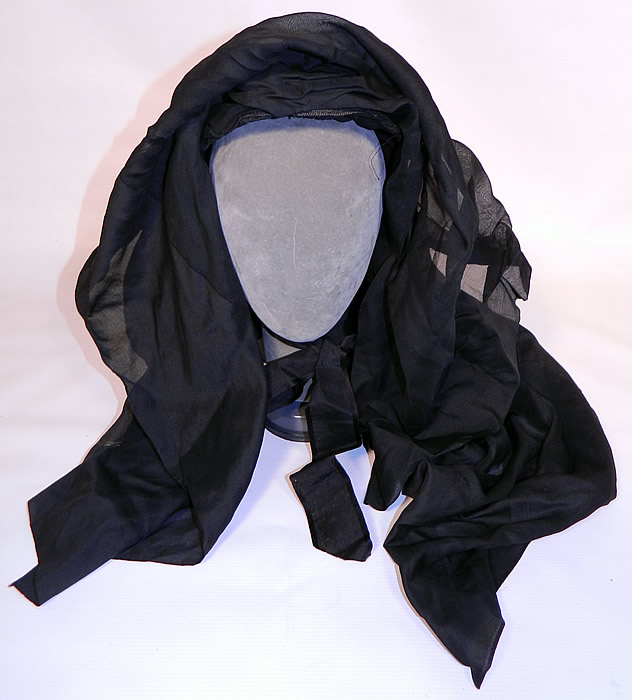 Victorian Woven Black Straw Layered Silk Veil Full Mourning Bonnet Hat. This antique Victorian woven black straw layered silk veil full mourning bonnet hat dates from the 1860s. It is made of a tightly woven black straw base covered with 2 layers of sheer black silk fabric and lined inside the front brim with a black silk crepe ruched fabric.