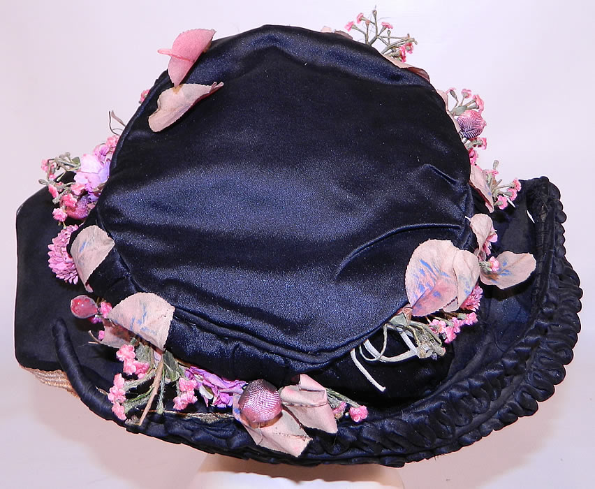 Edwardian Black Silk & Natural Straw Floral Garland Trim Wide Brim Hat. It is lined in a black silk fabric. The hat measures 22 inches inside crown circumference. 