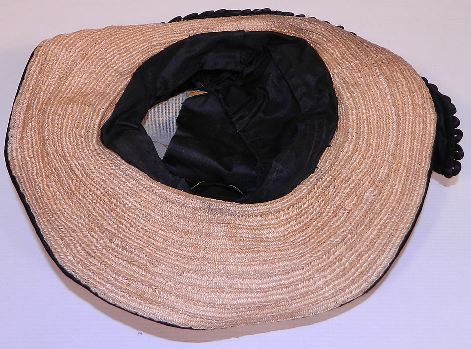 Edwardian Black Silk & Natural Straw Floral Garland Trim Wide Brim Hat. It is lined in a black silk fabric. The hat measures 22 inches inside crown circumference. 