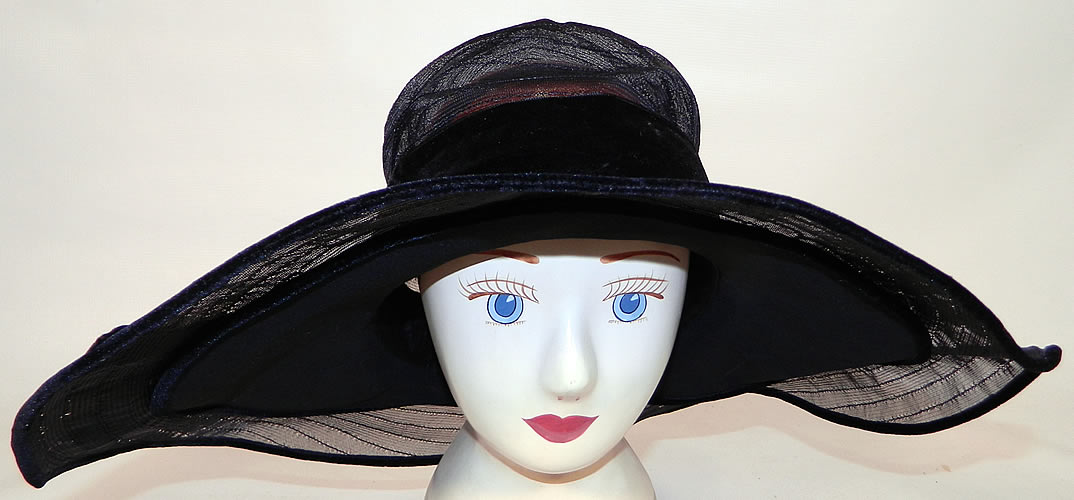 Vintage Gilman Importers Ritz Carlton New York Black Horse Hair Straw  Wide Brim Cloche Hat. The hat is made of a sheer woven black horse hair straw, with a black silk chiffon wired smaller brim lining underneath.