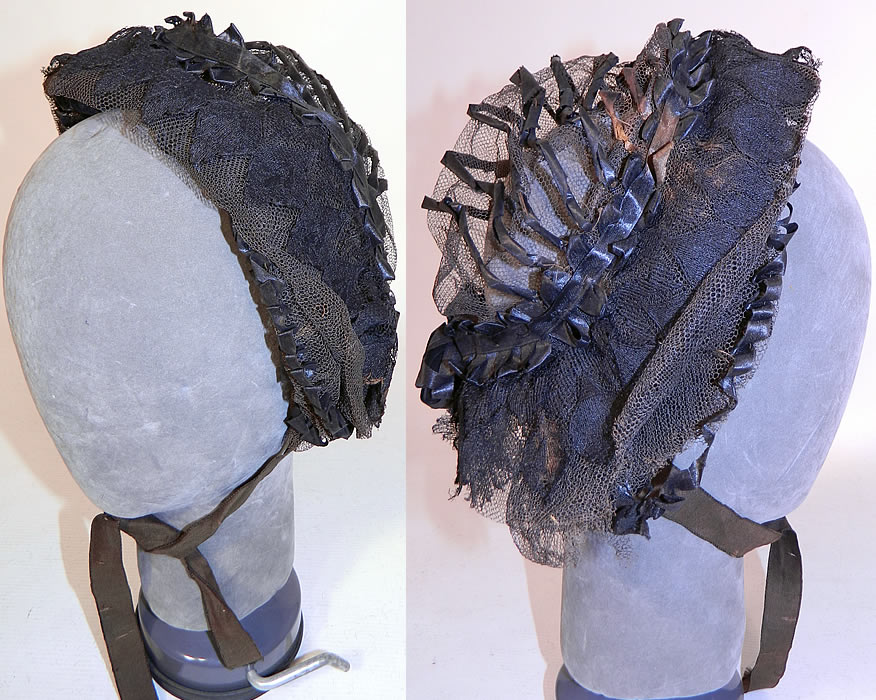 Victorian Civil War Era Black Net Ribbon Trim Mourning Bonnet Snood Headdress. It is made of a wired frame covered with a delicate fine sheer black net and black silk ribbon trim accents done in gathered loops and twisted stripes decorative designs. 