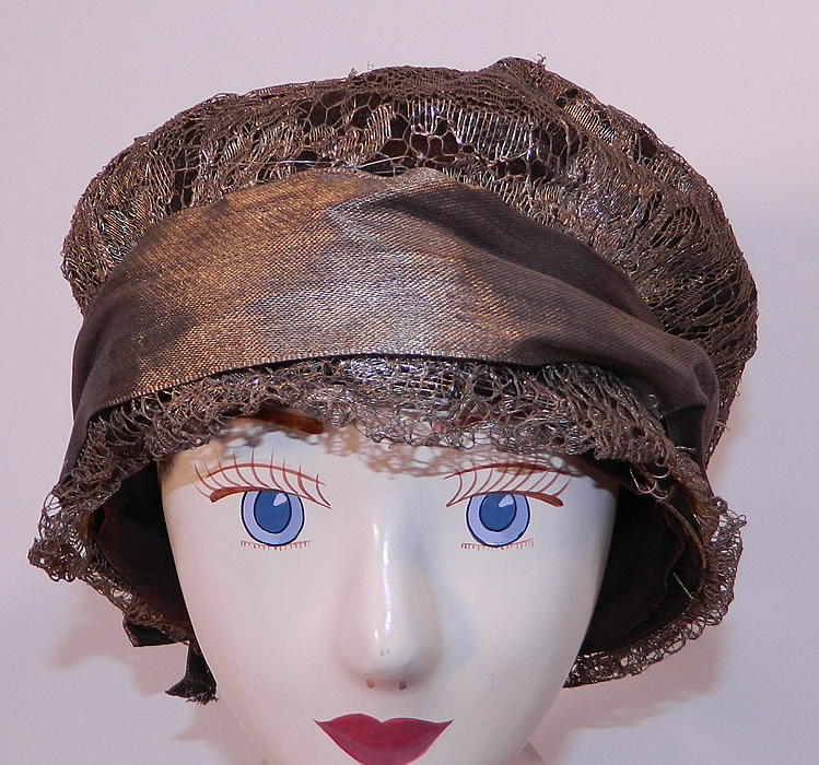 Vintage Art Deco Gold Lame Lam&eacute; Lace Flapper Cloche Hat. The hat is made of a wire frame covered with a sheer floral pattern gold metallic lam&eacute; lace. 