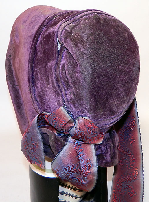 Victorian Civil War Era Antique Purple Violet Silk Velvet Drawn Spoon Bonnet. It is  lined inside with an off white muslin fabric. The bonnet measures 25 inches in circumference around the face and is 18 inches deep from front to back.