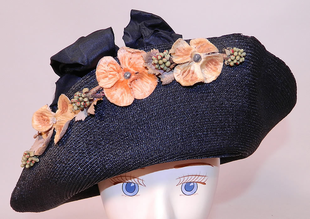 Edwardian Black Straw Orange Silk Velvet Floral Trim Upturned Wide Brim Hat. This vintage Edwardian era black straw orange silk velvet floral trim upturned wide brim hat dates from 1918. 