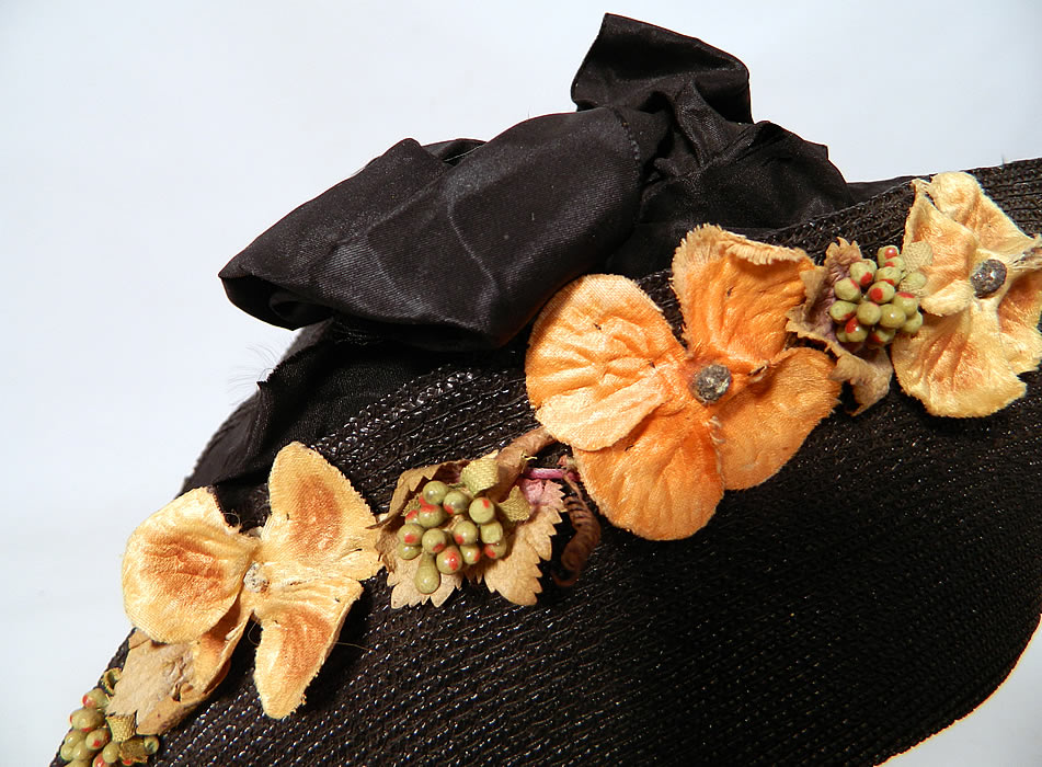 Edwardian Black Straw Orange Silk Velvet Floral Trim Upturned Wide Brim Hat.The hat measures 23 inches inside crown circumference. 