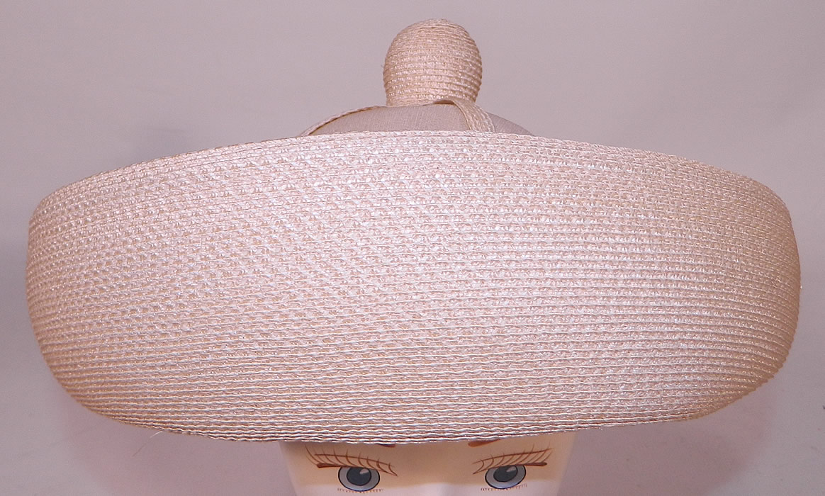 Vintage Oleg Cassini Woven Natural Straw Cream Silk Bumper Brim Hat. It is made of a light shade natural woven straw, with an off white ecru cream color silk fabric covered crown. 