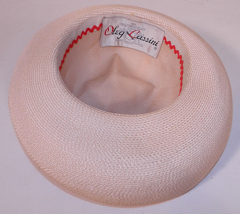 Vintage Oleg Cassini Woven Natural Straw Cream Silk Bumper Brim Hat. It is in good condition. This is truly a wonderful piece of quality made wearable millinery art! 