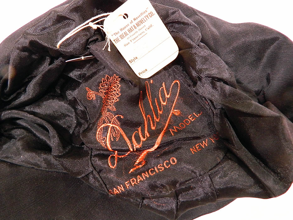 Vintage Dahlia Model Black Silk Velvet Gold Lame Lam&eacute; Embroidered Flapper Cloche Hat. This fabulous flapper cloche style hat is form fitting, with an uneven floppy brim and is fully lined inside with black silk and a "Dahlia Model San Francisco" label and original store tag attached. 