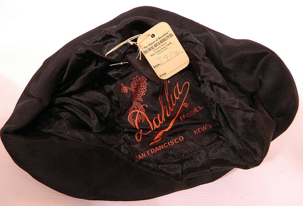 Vintage Dahlia Model Black Silk Velvet Gold Lame Lam&eacute; Embroidered Flapper Cloche Hat. This fabulous flapper cloche style hat is form fitting, with an uneven floppy brim and is fully lined inside with black silk and a "Dahlia Model San Francisco" label and original store tag attached. 
