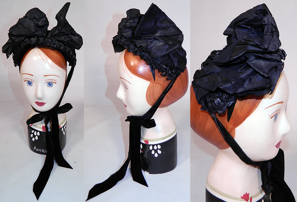 Victorian Black Straw Large Silk Bow Trim Mourning Half Bonnet Hat. This antique Victorian era black straw large silk bow trim mourning half bonnet hat dates from the 1880s. It is made of a black woven straw, with a large black silk ribbon bow trim on top.