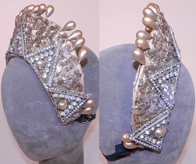 Vintage Sequin Pearl Rhinestone Beaded Tiara Crown Costume Flapper Headpiece. The headpiece is made of stiffened white satin fabric, covered with silver metallic sequins, pearls and rhinestone trimmings. 