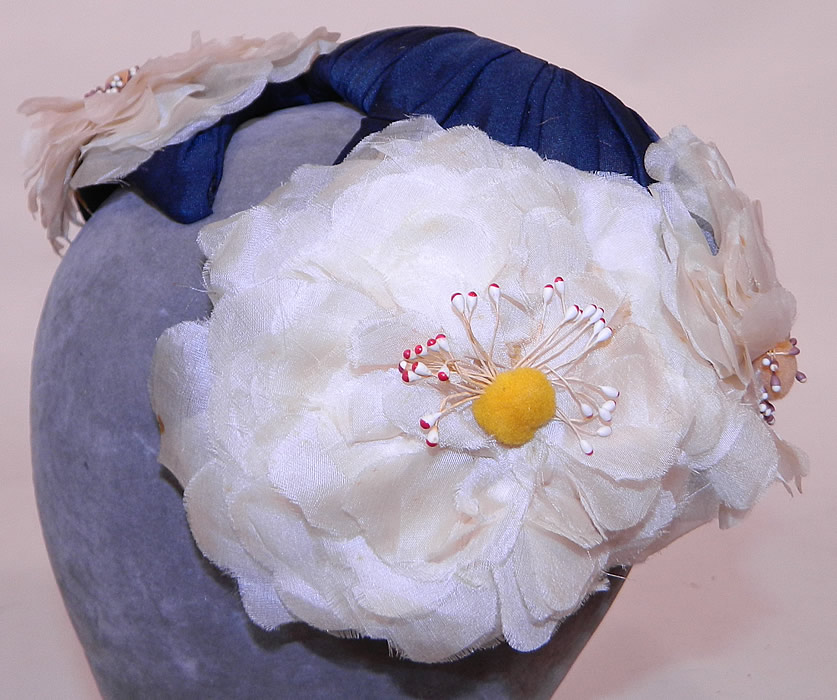 Vintage Rosa et Valentine Paris Label Blue Silk White Magnolia Flower Fascinator Hat.
 This vintage Rosa et Valentine Paris label blue silk white magnolia flower fascinator hat dates from the 1940s.