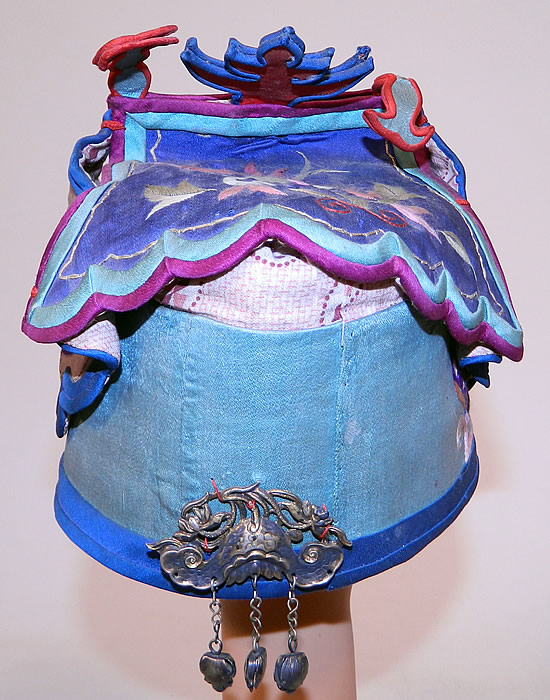 Antique Chinese Child Infant Silk Embroidered Silver Immortals Charm Wind Hat
These Han Chinese children's and infant hats were designed to provide protection from evil spirits, demons, and ghosts, but also to influence the wearing with important qualities such as wealth, health, courage, academic success, happiness, long life, grace and beauty. 