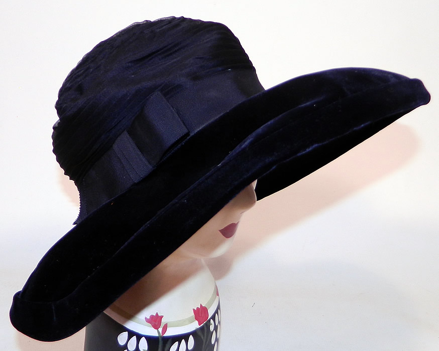 Vintage Joseph Magnin Black Pleated Ruched Silk Velvet Wide Brim Hat 
This vintage Joseph Magnin black pleated ruched silk velvet wide brim hat dates from the 1950s. 