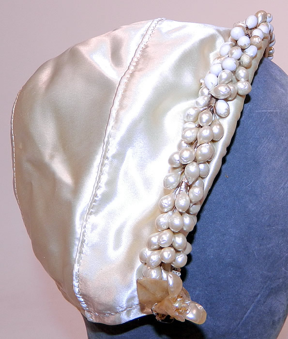 Vintage White Satin Bridal Wedding Cap Orange Blossom Wax Flower Trim
It is in good condition, with some wax droplets missing the pearl coating worn white. 