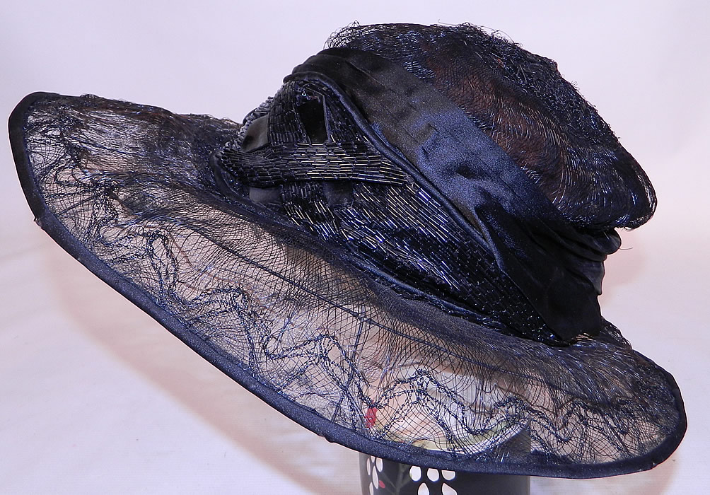 Vintage Burke Beaded Black Woven Horse Hair Straw Sheer Wide Brim Cloche Hat
There is black jet beaded trim done in an Art Deco geometric design on the front hatband. 