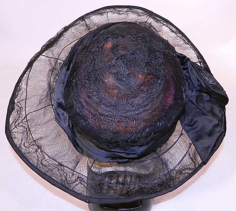 Vintage Burke Beaded Black Woven Horse Hair Straw Sheer Wide Brim Cloche Hat
This fabulous flapper cloche style hat has a wide brim which has an uneven asymmetrical oval shape, wider along the sides and is sheer, completely unlined. 