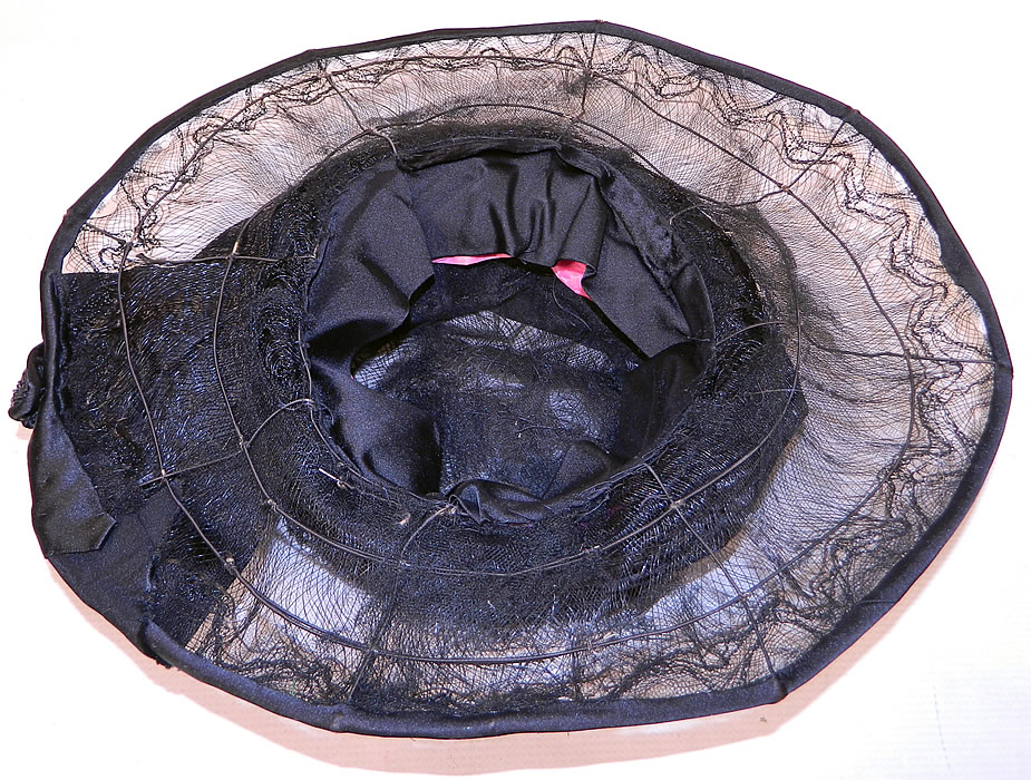 Vintage Burke Beaded Black Woven Horse Hair Straw Sheer Wide Brim Cloche Hat
The hat measures 22 inches inside crown circumference and 50 inches outer brim. It is in good condition, with only a few small breaks in the net. This is truly a wonderful piece of wearable Art Deco millinery art! 