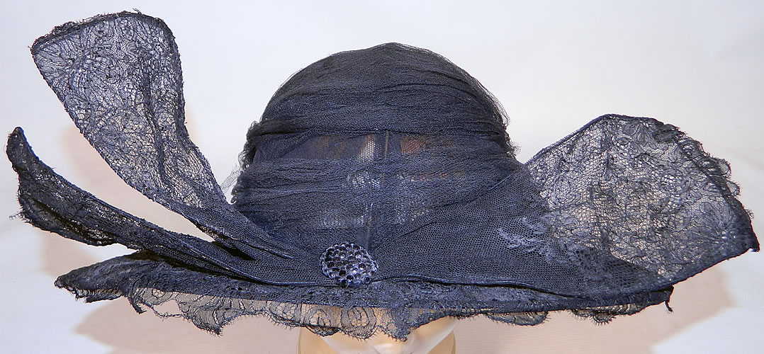 Vintage Black Chantilly Lace Wired Wing Trim Wide Brim Cloche Hat
This vintage black chantilly lace wired wing trim wide brim cloche hat dates from the 1920s.