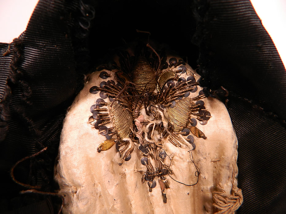 Antique Black Silk Ribbon Gold Bullion Embroidered Bavarian German Folk Bonnet Hat
The beautiful bonnet measures 15 inches around the face. It is in good condition, with only some minor wear and a few loose missing gold trimmings off the back. This is a truly a rare and wonderful piece of early German regional textile folk art! 