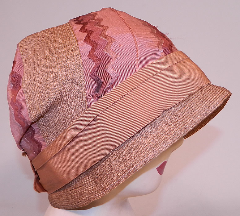 Vintage Art Deco Tango Pink Silk Ribbon & Woven Straw  Flapper Cloche Hat 
It is made of a dusty rose, tango pink color tightly woven straw, with matching silk damask ribbon trim with a Art Deco chevron brocade design. 