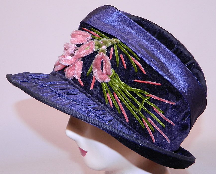 Vintage Periwinkle Silk Velvet Wide Brim Chenille Embroidered Flower Flapper Cloche Hat
It is made of a dark bluish purple periwinkle color silk and velvet fabric, with green and pink chenille embroidered flowers on the front. 