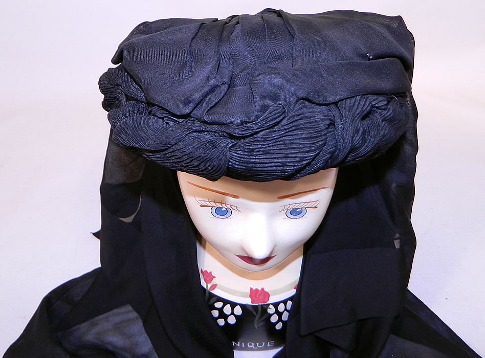Victorian C.F. Hovey & Co Boston Label Black Silk Crepe Veil Full Mourning Bonnet Hat
It is made of a black crepe fabric with a finely pleated rolled twisted trim around the base, covered with 2 layers of sheer black silk fabric and lined inside in black silk. 