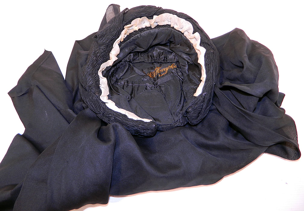 Victorian C.F. Hovey & Co Boston Label Black Silk Crepe Veil Full Mourning Bonnet Hat
This marvelous mourning bonnet has a layered veil which can be worn covering the face or folded back over the head and has a "C.F. Hovey & Co. Boston Paris" store label sewn inside.
