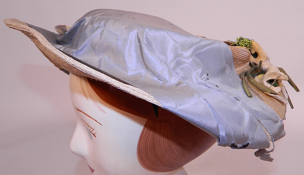 Victorian White Woven Straw Blue Silk Ribbon Floral Trim Wide Brim Gainsborough Hat
There is a small inside crown lined in a white silk fabric with a black velvet shelf brim underneath on the back. 