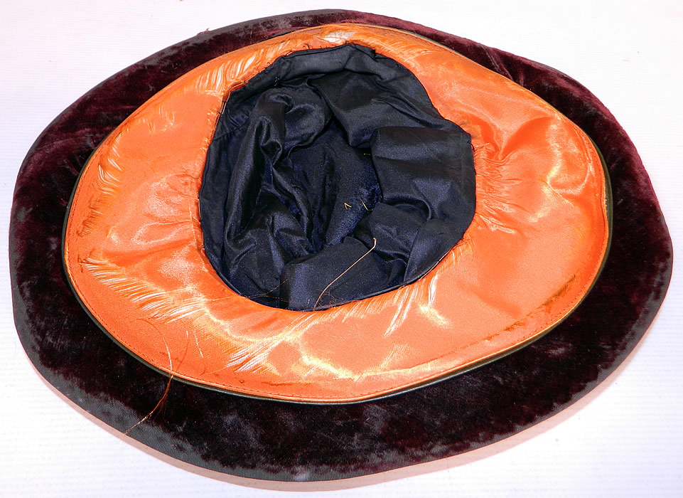 Vintage Burgundy Velvet Orange Silk Brown Cutwork Beaded Trim Wide Brim Cloche Hat
It is in good condition, with some wear to the velvet nap and frayed splits on the orange silk brim lining. This is truly a wonderful piece of wearable Art Deco millinery art!