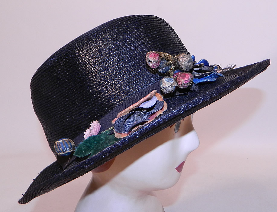 Edwardian Belle Epoque Woven Black Straw Gold Metallic Floral Trim Wide Brim Hat
This Edwardian era Belle Epoque woven black straw gold metallic floral trim wide brim hat dates from 1915.