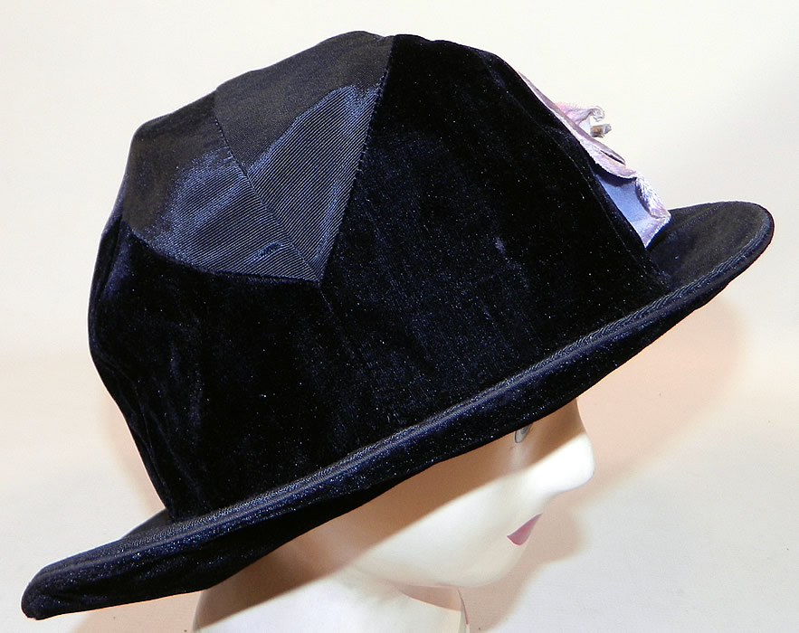 Vintage Hart Hats Black Silk Velvet Wide Brim Purple Flower Flapper Cloche Hat
It is made of a two tone black silk and velvet fabrics, with a large varying shades of purple velvet fabric flower trim on the side. 