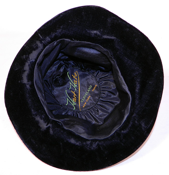 Vintage Hart Hats Black Silk Velvet Wide Brim Purple Flower Flapper Cloche Hat
The hat measures 22 inches inside crown circumference. It is in good condition, with only some minor wear to the velvet nap underneath the brim. 