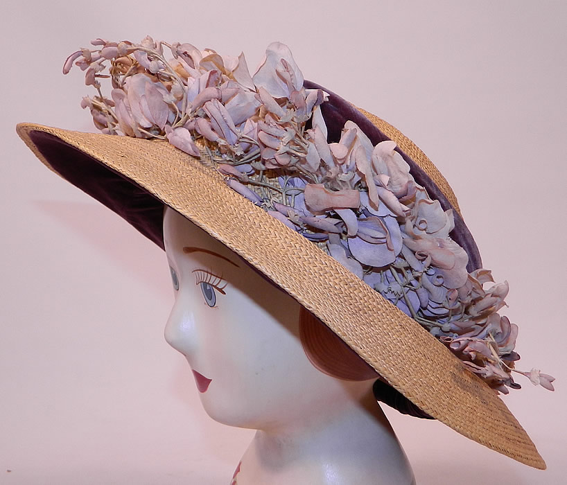 Edwardian Woven Natural Straw Purple Velvet Violet Flower Trim Wide Brim Hat
This Edwardian era woven natural straw purple velvet violet flower trim wide brim hat dates from 1910.