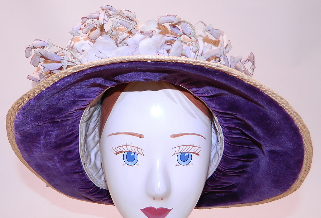 Edwardian Woven Natural Straw Purple Velvet Violet Flower Trim Wide Brim Hat
It is made of a tightly woven natural straw, with purple velvet fabric under the brim, around the brim and a garland wreath of faded purple violet flowers trim. 