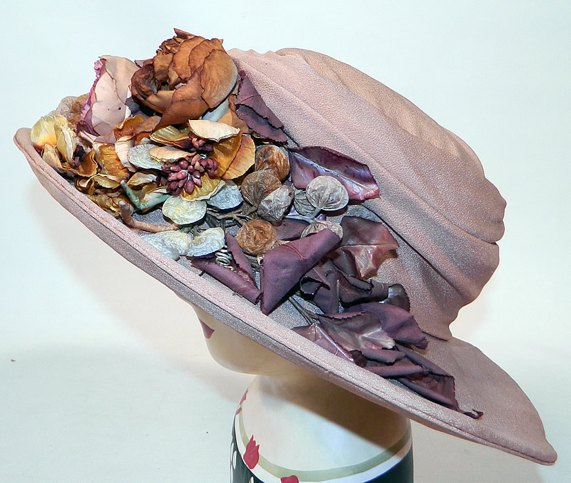Edwardian Belle Epoque Taupe Silk Autumn Fall Floral Foliage Trim Wide Brim Hat
This Edwardian era Belle Epoque taupe silk autumn fall floral foliage trim wide brim hat dates from 1915.