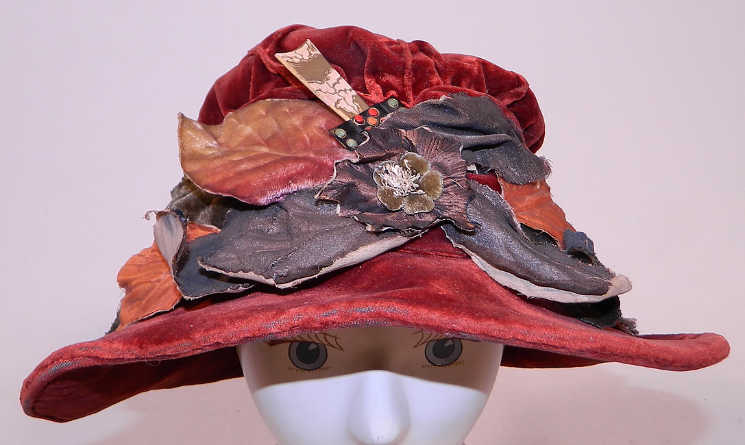 Vintage Autumn Burgundy Red Velvet Silver Lame Leaf Trim Wide Brim Cloche Hat Lam&eacute;
This vintage autumn burgundy red velvet silver lam&eacute; leaf trim wide brim cloche hat dates from the 1920s. 